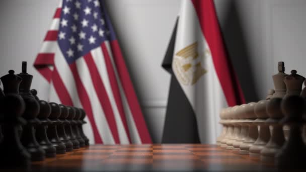 Drapeaux des États-Unis et de l'Égypte derrière des pions sur l'échiquier. Jeu d'échecs ou rivalité politique liée à l'animation 3D — Video