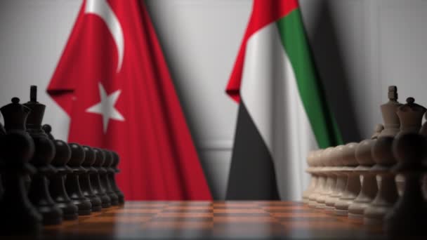 Flaggor i Turkiet och UAE bakom brickor på schackbrädet. Schack spel eller politisk rivalitet relaterade 3D-animering — Stockvideo