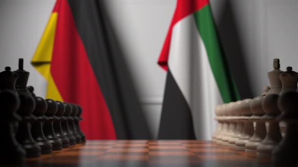 Fahnen von Deutschland und uae hinter Bauern auf dem Schachbrett. Schachspiel oder politische Rivalität im Zusammenhang mit 3D-Animation — Stockvideo