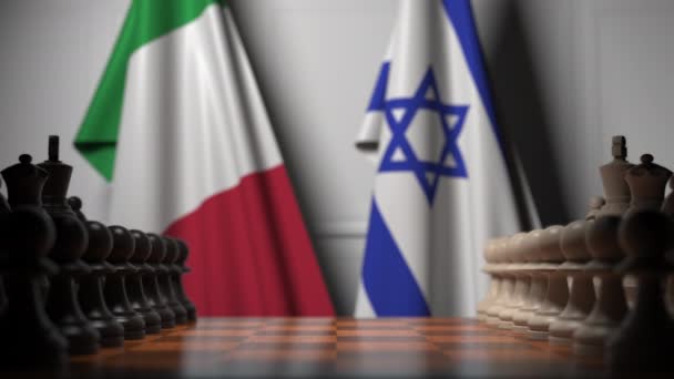 Flaggor i Italien och Israel bakom brickor på schackbrädet. Schack spel eller politisk rivalitet relaterade 3D-animering — Stockvideo