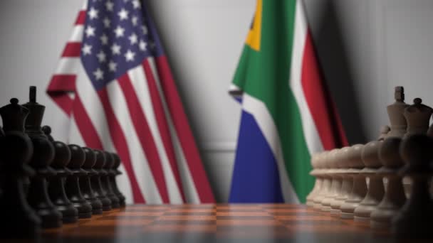 Drapeaux des États-Unis et d'Afrique du Sud derrière des pions sur l'échiquier. Jeu d'échecs ou rivalité politique liée à l'animation 3D — Video
