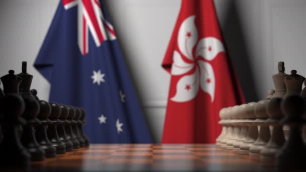 Drapeaux de l'Australie et de Hong Kong derrière pions sur l'échiquier. Jeu d'échecs ou rivalité politique liée à l'animation 3D — Video