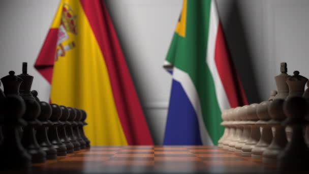 Satranç tahtasındaki piyonların arkasında İspanya ve Güney Afrika bayrakları. Satranç oyunu veya siyasi rekabet ile ilgili 3d animasyon — Stok video