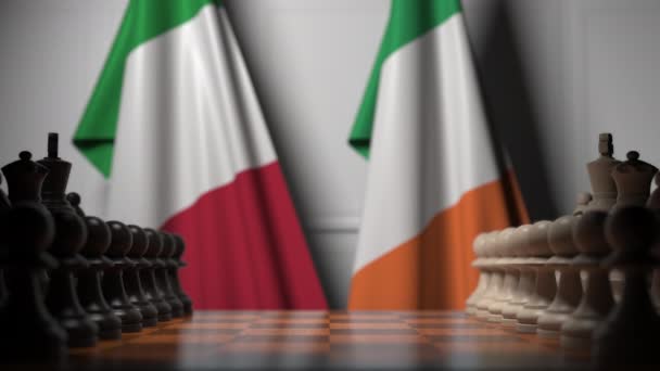 Banderas de Italia e Irlanda detrás de peones en el tablero de ajedrez. Juego de ajedrez o rivalidad política relacionada con la animación 3D — Vídeo de stock