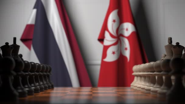 Tayland ve Hong Kong bayrakları satranç tahtasındaki piyonların arkasında. Satranç oyunu veya siyasi rekabet ile ilgili 3d animasyon — Stok video