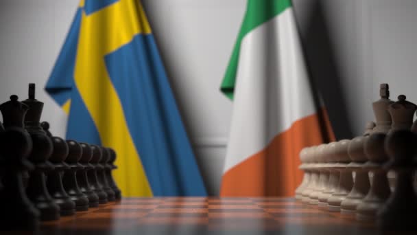 瑞典和爱尔兰的旗帜在棋盘上的棋子后面。国际象棋游戏或政治竞争相关3D动画 — 图库视频影像