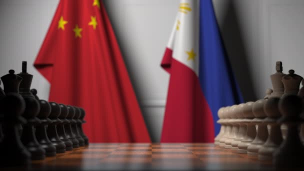 チェスボードのポーンの後ろに中国とフィリピンの旗。チェスゲームや政治的ライバル関連の3Dアニメーション — ストック動画