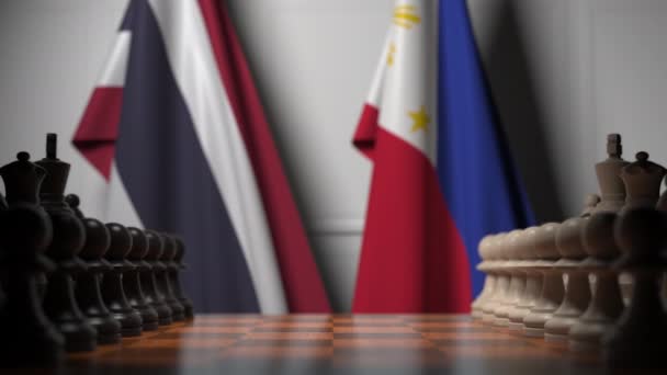 Zászlók Thaiföld és Fülöp-szigetek mögött gyalog a sakktáblán. Sakk-játék vagy politikai rivalizálás 3D animáció — Stock videók