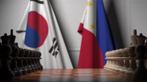 棋盘上的棋子后面是韩国和菲律宾的旗帜。国际象棋游戏或政治竞争相关3D动画 — 图库视频影像