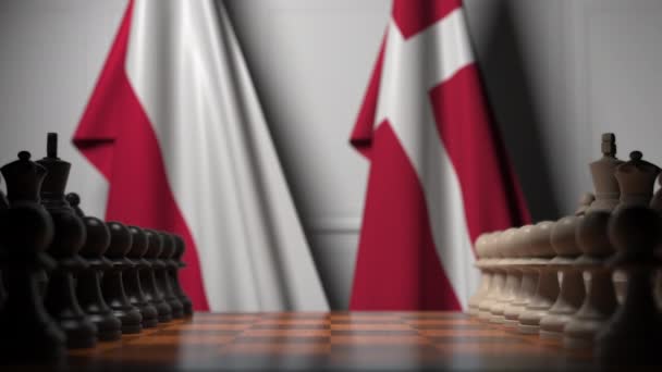 Banderas de Polonia y Dinamarca detrás de peones en el tablero de ajedrez. Juego de ajedrez o rivalidad política relacionada con la animación 3D — Vídeo de stock