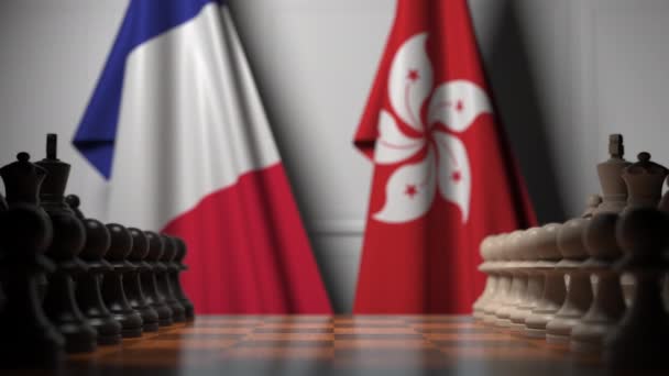 Bandeiras de França e Hong Kong atrás de peões no tabuleiro de xadrez. Jogo de xadrez ou rivalidade política relacionada com animação 3D — Vídeo de Stock