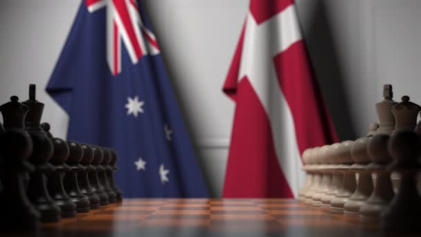 Banderas de Australia y Dinamarca detrás de peones en el tablero de ajedrez. Juego de ajedrez o rivalidad política relacionada con la animación 3D — Vídeo de stock