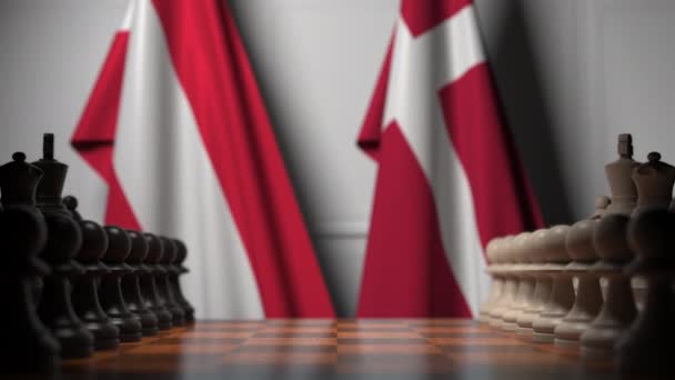 Österrikes och Danmarks flaggor bakom brickor på schackbrädet. Schack spel eller politisk rivalitet relaterade 3D-animering — Stockvideo