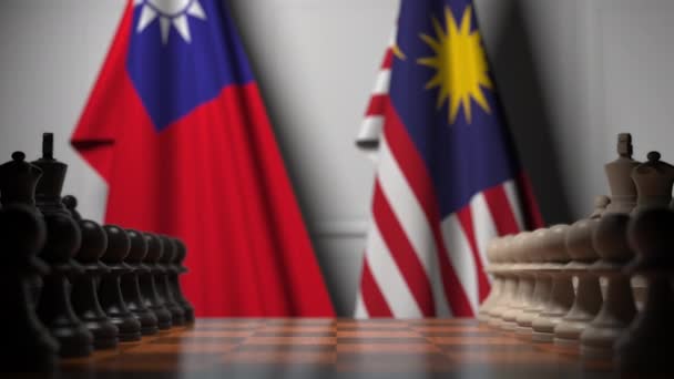 Flaggen von Taiwan und Malaysia hinter Bauern auf dem Schachbrett. Schachspiel oder politische Rivalität im Zusammenhang mit 3D-Animation — Stockvideo