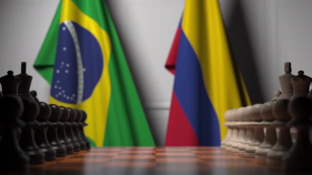 Flags of Brazil and Colombia behind pawns on the chessboard. Chess game or political rivalry related 3D animation — Stock Video