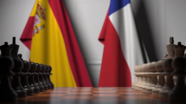 Drapeaux d'Espagne et du Chili derrière des pions sur l'échiquier. Jeu d'échecs ou rivalité politique liée à l'animation 3D — Video