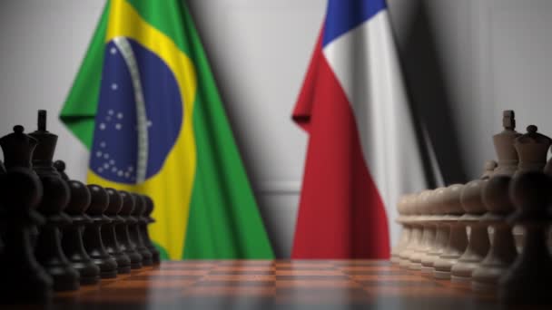 Flags of Brazil and Chile behind pawns on the chessboard. Chess game or political rivalry related 3D animation — Stock Video