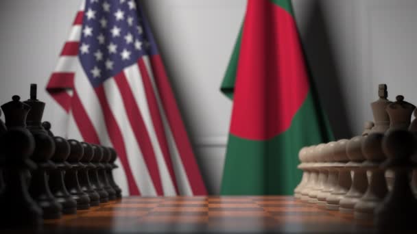 Флаги США и Бангладеш за пешками на шахматной доске. Шахматная игра или политическое соперничество — стоковое видео