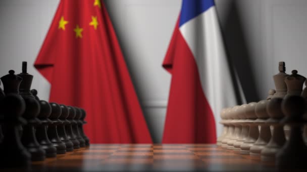 チェスボードのポーンの後ろに中国とチリの旗。チェスゲームや政治的ライバル関連の3Dアニメーション — ストック動画