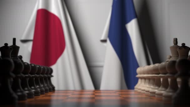 Satranç tahtasındaki piyonların arkasında Japonya ve Finlandiya bayrakları. Satranç oyunu veya siyasi rekabet ile ilgili 3d animasyon — Stok video