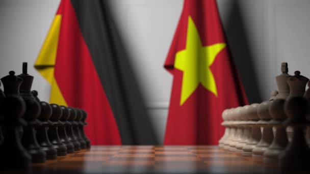 德国国旗和棋盘上的棋子后面越南。国际象棋游戏或政治竞争相关3D动画 — 图库视频影像