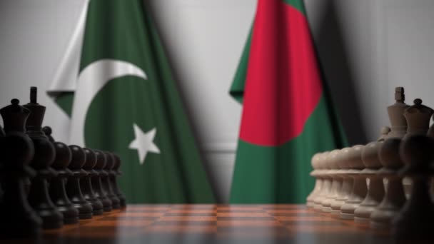 チェスボードのポーンの後ろにパキスタンとバングラデシュの旗。チェスゲームや政治的ライバル関連の3Dアニメーション — ストック動画