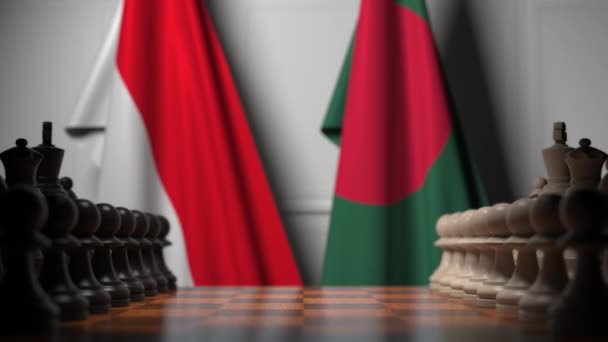 Bandeiras da Indonésia e Bangladesh atrás de peões no tabuleiro de xadrez. Jogo de xadrez ou rivalidade política relacionada com animação 3D — Vídeo de Stock