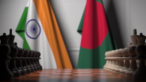 チェスボードのポーンの後ろにインドとバングラデシュの旗。チェスゲームや政治的ライバル関連の3Dアニメーション — ストック動画