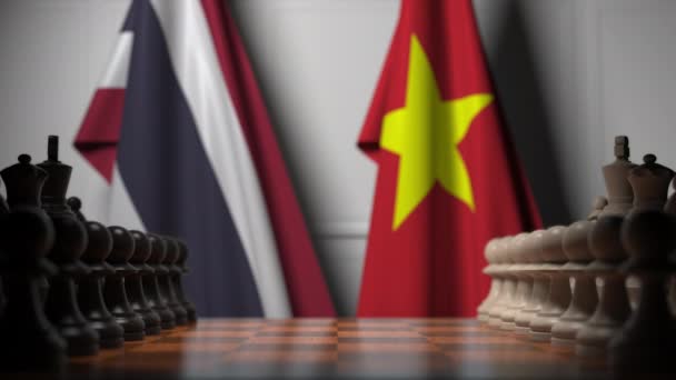 Flaggor i Thailand och Vietnam bakom brickor på schackbrädet. Schack spel eller politisk rivalitet relaterade 3D-animering — Stockvideo