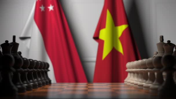 Флаги Сингапура и Вьетнама за пешками на шахматной доске. Шахматная игра или политическое соперничество — стоковое видео