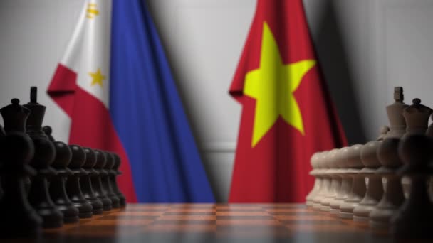 Flags of Philippines and Vietnam behind pawns on the chessboard. Chess game or political rivalry related 3D animation — Stock Video