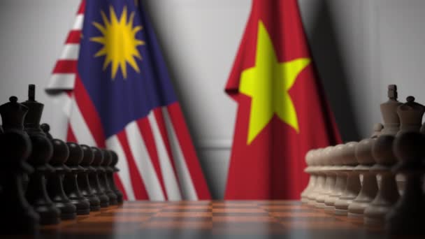 马来西亚国旗和棋盘上的棋子后面越南。国际象棋游戏或政治竞争相关3D动画 — 图库视频影像