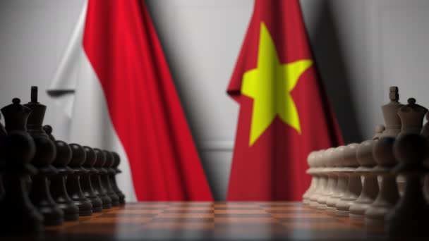 Bandiere dell'Indonesia e del Vietnam dietro pedoni sulla scacchiera. Gioco di scacchi o rivalità politica relativi animazione 3D — Video Stock