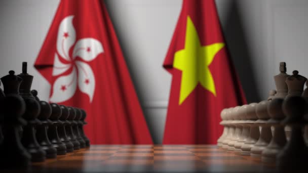 チェスボードのポーンの後ろに香港とベトナムの旗。チェスゲームや政治的ライバル関連の3Dアニメーション — ストック動画