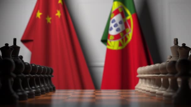 Flags of China and Portugal behind pawns on the chessboard. Chess game or political rivalry related 3D animation — Stock Video