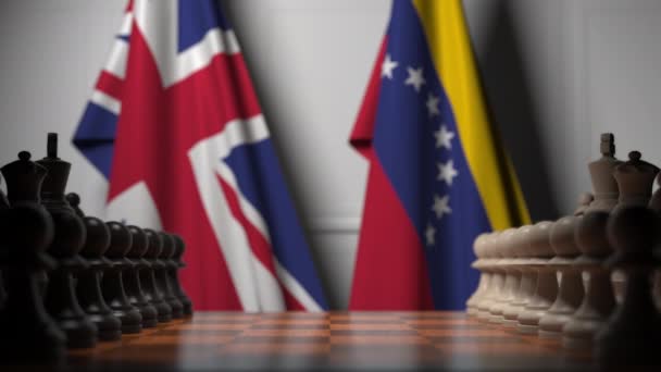 Drapeaux de la Grande-Bretagne et du Venezuela derrière des pions sur l'échiquier. Jeu d'échecs ou rivalité politique liée à l'animation 3D — Video