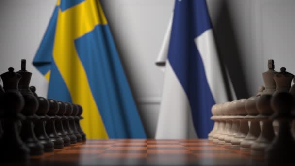 Drapeaux de la Suède et de la Finlande derrière pions sur l'échiquier. Jeu d'échecs ou rivalité politique liée à l'animation 3D — Video