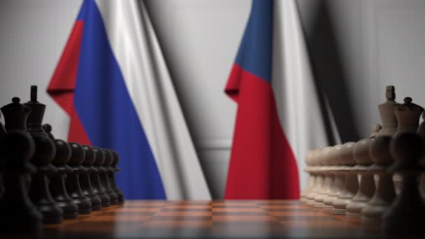 Flags of Russia and the Czech Republic behind pawns on the chessboard. Chess game or political rivalry related 3D animation — Wideo stockowe