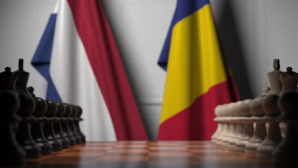 Nederländernas och Rumäniens flaggor bakom brickor på schackbrädet. Schackspel eller politisk rivalitet relaterad 3D-animation — Stockvideo