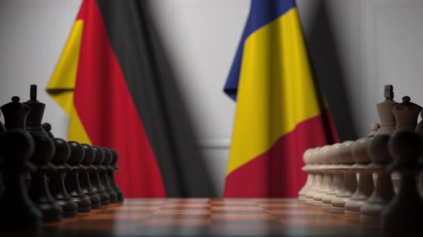 Bandiere di Germania e Romania dietro pedoni sulla scacchiera. Gioco di scacchi o rivalità politica relativi animazione 3D — Video Stock