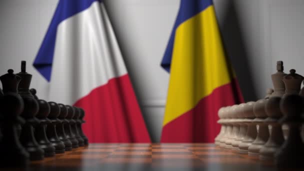 Flags of France and Romania behind pawns on the chessboard. Chess game or political rivalry related 3D animation — Stock Video