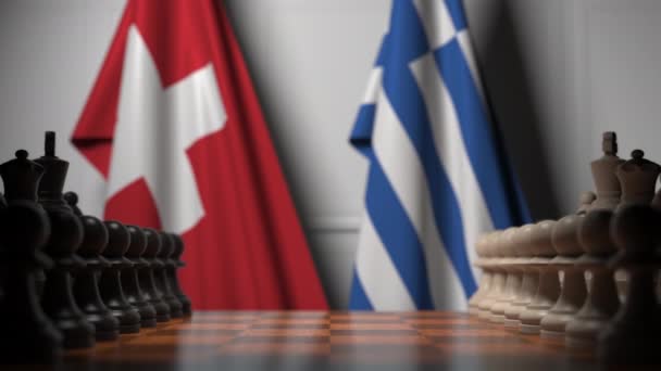 Drapeaux de la Suisse et de la Grèce derrière pions sur l'échiquier. Jeu d'échecs ou rivalité politique liée à l'animation 3D — Video