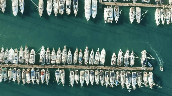 Aerial top down view of many docked sailing yachts in marina — 스톡 사진