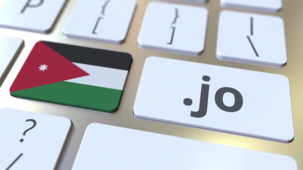 Иорданский домен .jo и флаг Иордании на кнопках на клавиатуре компьютера. Национальная интернет-анимация — стоковое видео