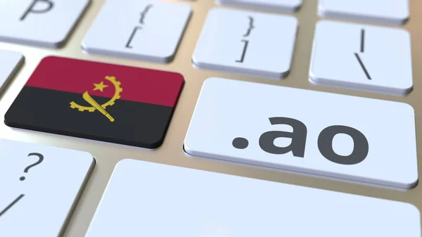 Angolan domain.ao 그리고 컴퓨터 키보드의 버튼에 앙골라의 깃발. National internet related 3d rendering — 스톡 사진