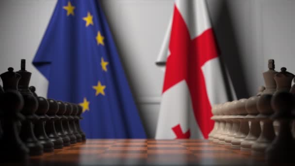 Bandiere dell'UE e della Georgia dietro pedine sulla scacchiera. Gioco di scacchi o rivalità politica relativi animazione 3D — Video Stock
