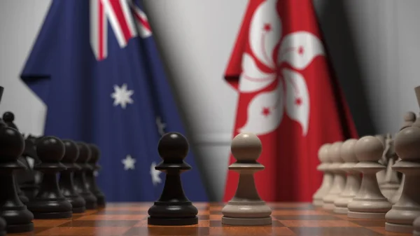 チェスボード上の質屋の後ろにオーストラリアと香港の旗。チェスゲームや政治的ライバル関係の3Dレンダリング — ストック写真