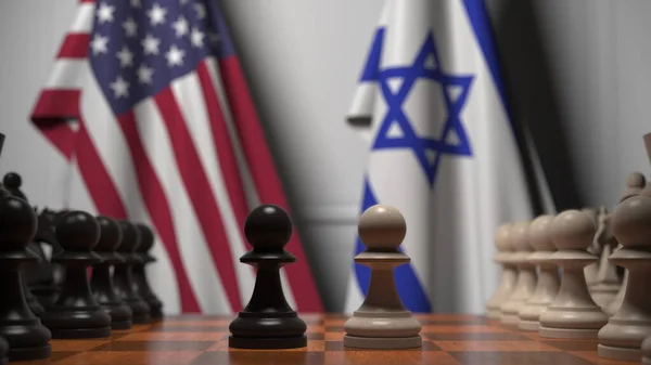 Флаги США и Израиля за пешками на шахматной доске. Шахматная игра или политическое соперничество — стоковое фото