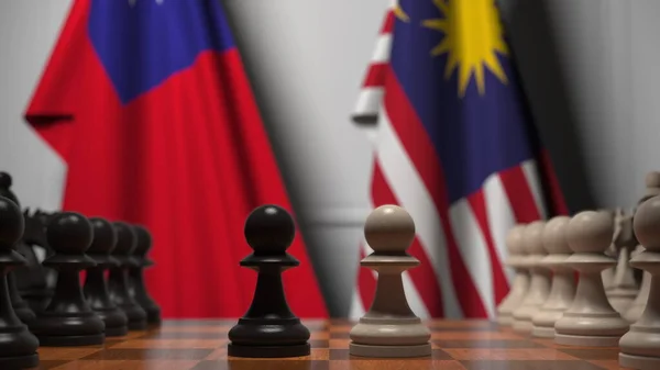 Flaggor från Taiwan och Malaysia bakom brickor på schackbrädet. Schackspel eller politisk rivalitet relaterad till 3D-rendering — Stockfoto