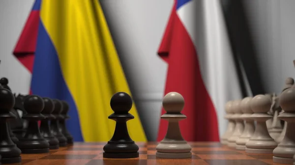 Colombias och Chiles flaggor bakom brickor på schackbrädet. Schackspel eller politisk rivalitet relaterad till 3D-rendering — Stockfoto